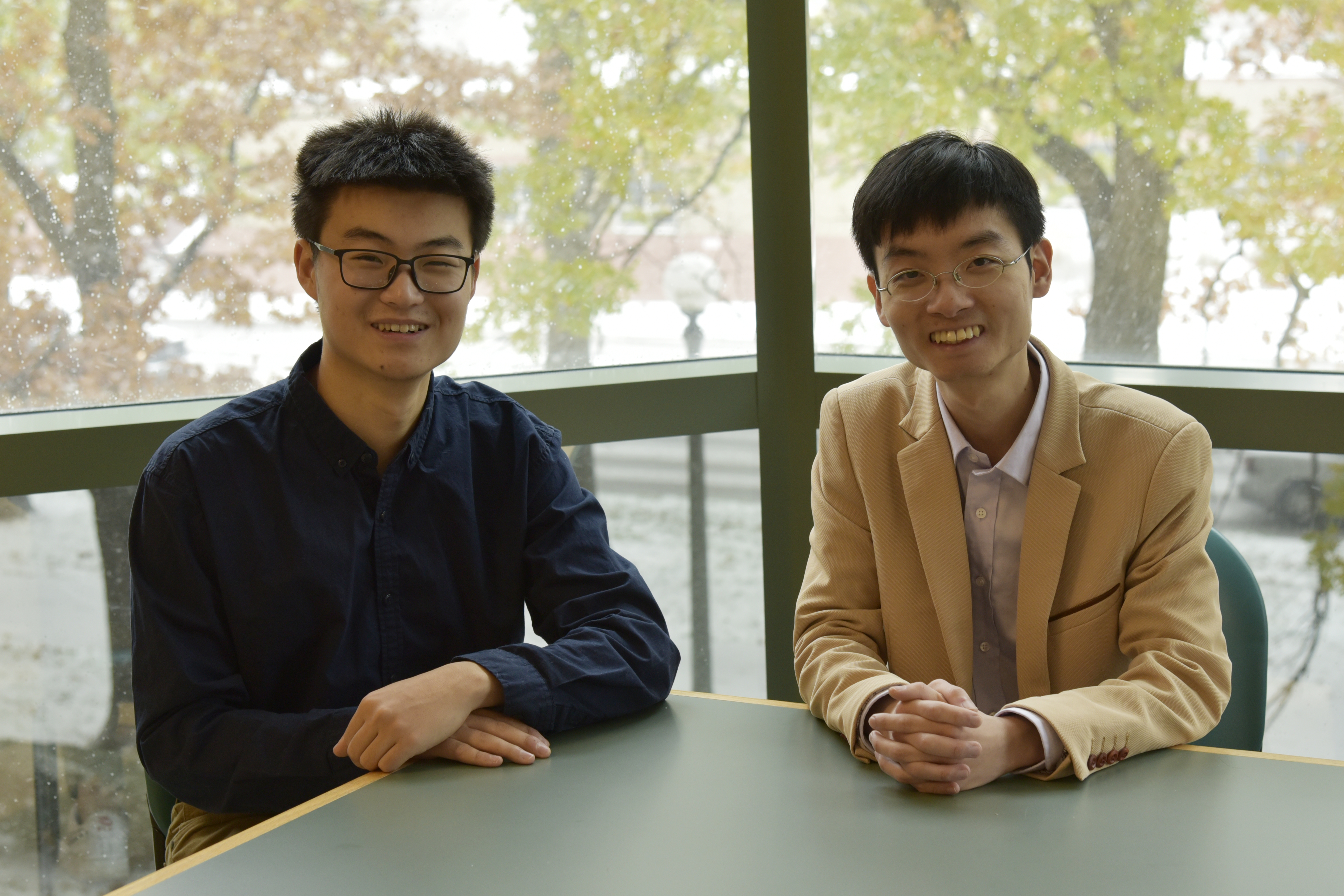 Moore Group members Yuan Jia (left), an undergraduate in chemistry, and Yun Liu, a postdoctoral researcher