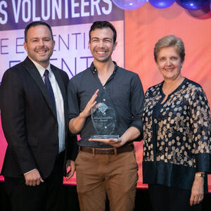Kyle Shelton (Doug Mitchell group), middle accepts the ChemLuminary Award at the fall 2019 ACS national meeting. There is a man to his left and a woman to his right.