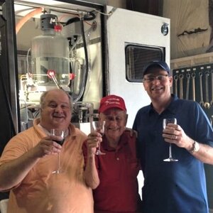 Greg George, Ben Mosier and Rick Ford stand in front of their patented technology that improves taste of distilled spirits