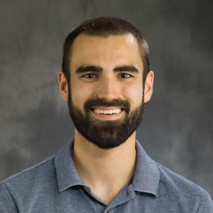 Head shot of Matthew Boudreau on a gray background