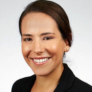 Head shot of alumna Markita Landry on a light gray background