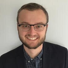 Head shot of Nick Jackson on a light gray background
