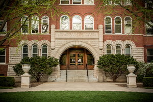 Portrait of the main arched west-facing entrance to Noyes Lab.