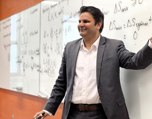 Prashant Jain teaches class standing in front of a wipe off board in a Noyes classroom.