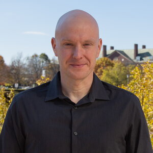 Head shot of Doug Mitchell in an outdoor setting