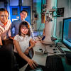 Professor Qian Chen, seated, and graduate students Binbin Luo, left, and Zihao Ou 