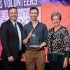 Kyle Shelton (Doug Mitchell group), middle accepts the ChemLuminary Award at the fall 2019 ACS national meeting. There is a man to his left and a woman to his right.