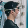 Kyle Ritchie demonstrating the newly designed face shield