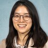 Head shot of Hee Sun Han on a blue background