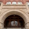 Photo focused on the stone arch in the main entrance to Noyes Lab.