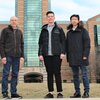 From left, Jeffrey Moore, William Neary and Yunyan Sun stand on campus with the Beckman Institute in the background.