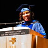 Alveda Williams standing at the speaker's podium during Convocation in the Tryon Theater at Krannert Center.