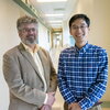 Jonathan Sweedler stands next to Fan Lam in a hallway on the Illinois campus.